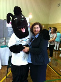 Jet hugs a lady at the Seniors’ expo Bunbury