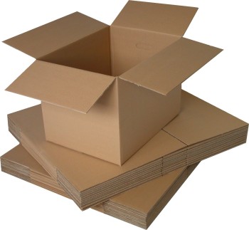A pile of cardboard boxes flat packed with an open cardboard box on the top