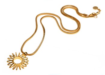A gold sun charm on a gold chain on a white background