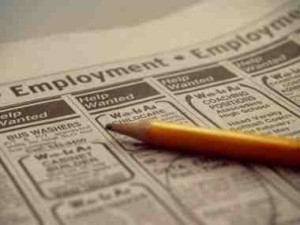 An employment add circled in a newspaper