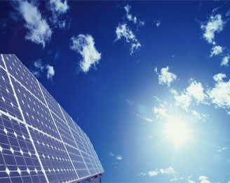 A solar panel against blue sky and white clouds