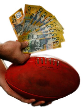 A hand holding a dirty red football and a large number of Australian $50 notes on a whitebackground