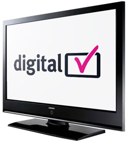 A flat screen TV monitor with digital TV and a pink tick written on it
