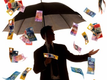 Australian money raining on a man holding an umbrella 