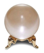 A pink crystal ball on a gold stand